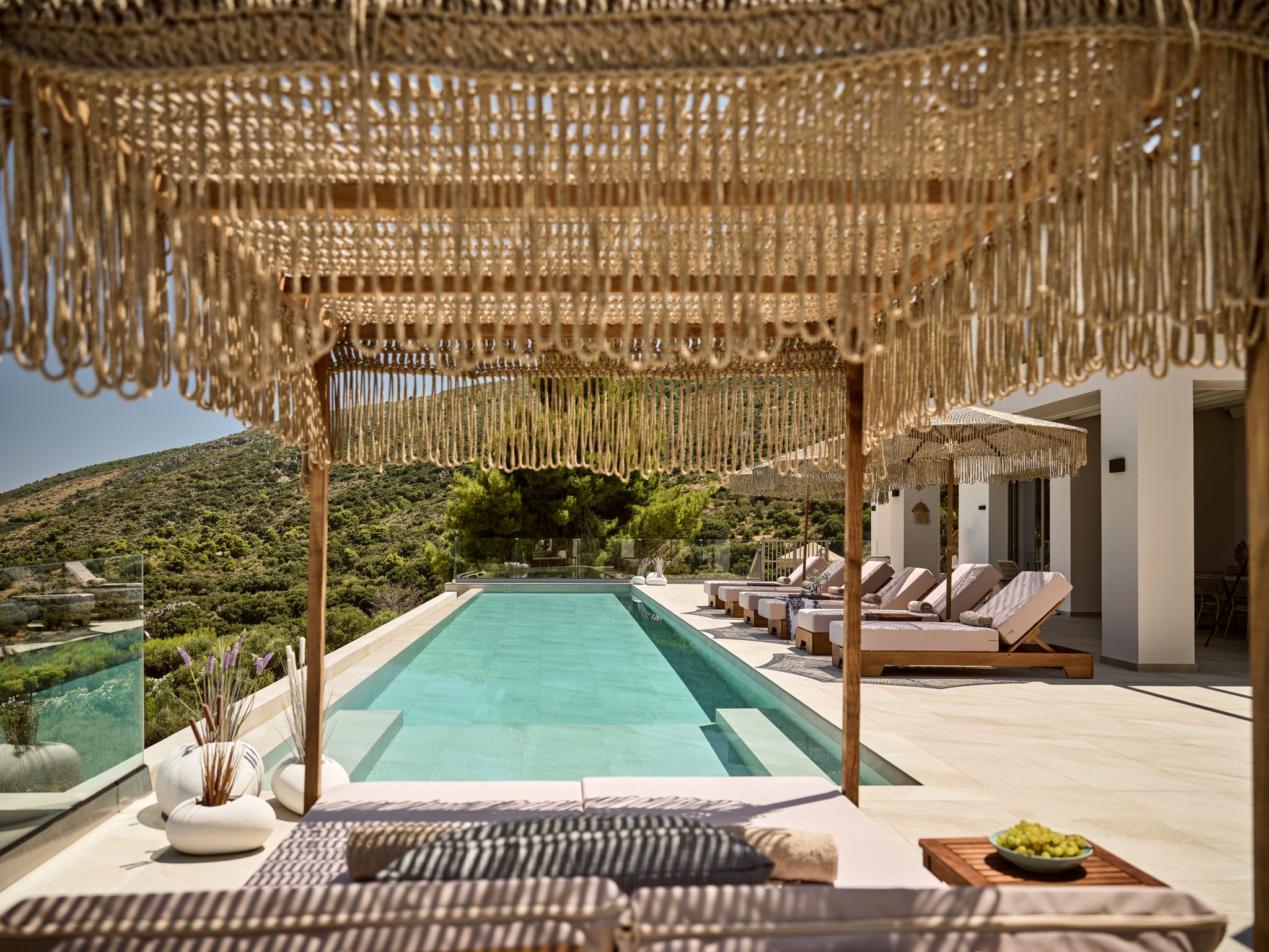 Shaded pool cabana with loungers at Segreto Del Lusso